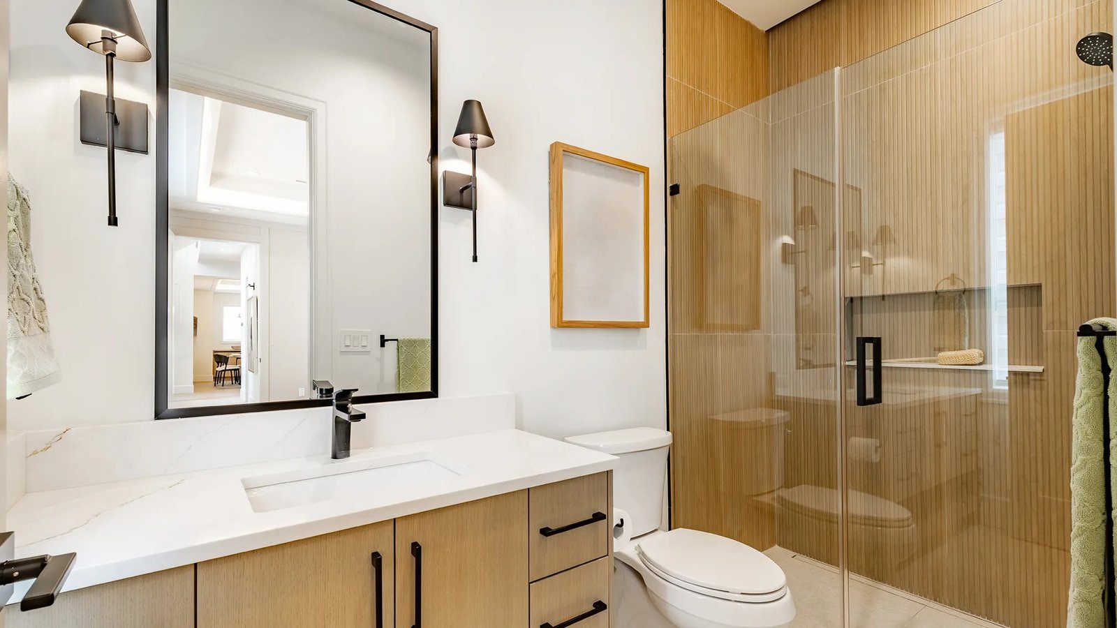 Modern bathroom remodeling with custom vanity, glass shower, and contemporary finishes