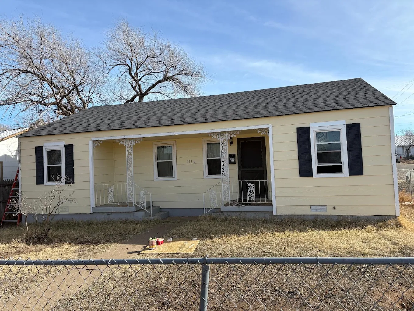 Freshly painted single-family home with new siding and updated exterior finishes