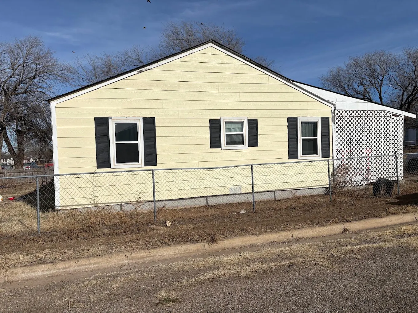 Residential siding installation and exterior house painting on a single-family home